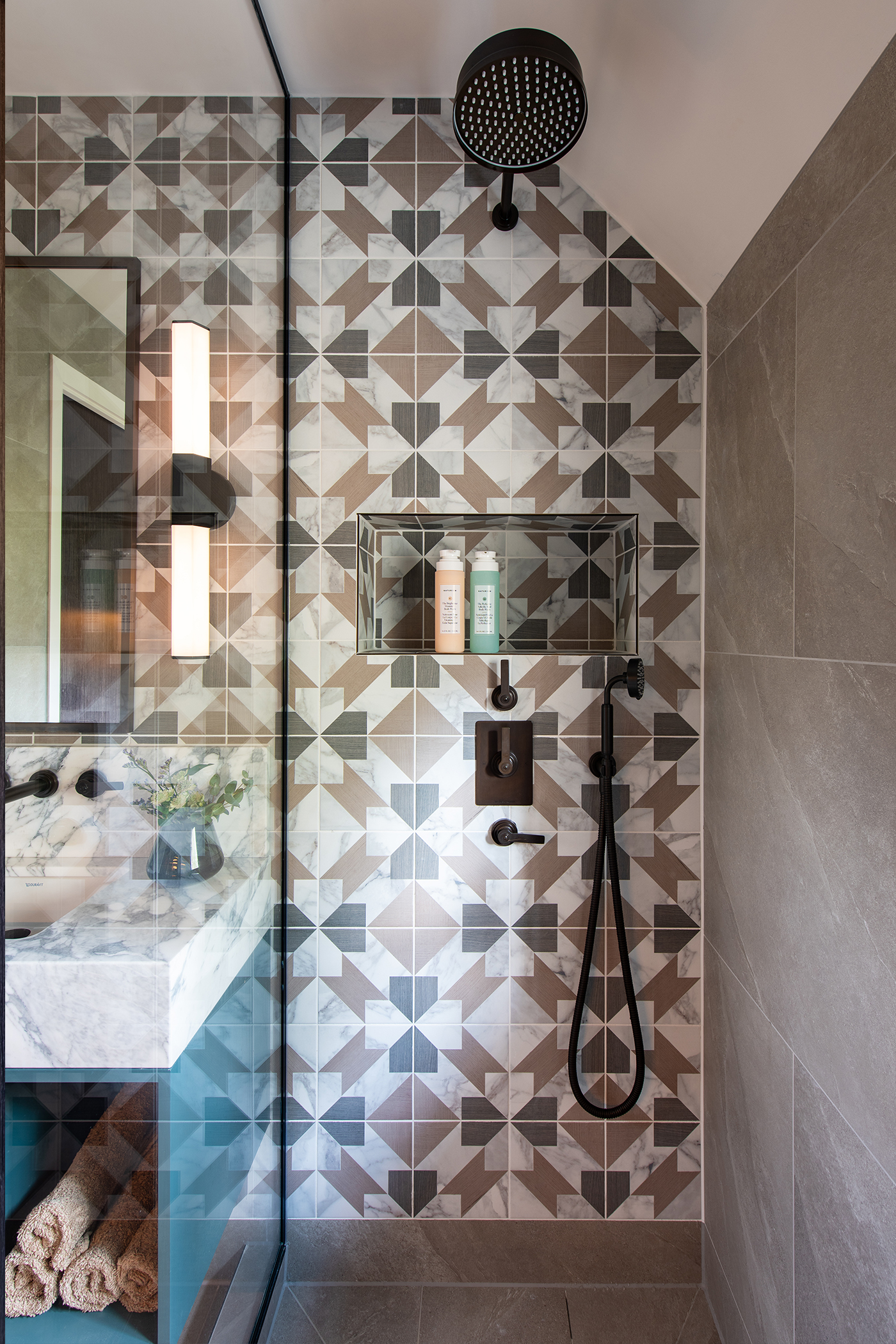 youngest son's ensuite with geometric tile shower and LMK pure concealed shower set by samuel heath